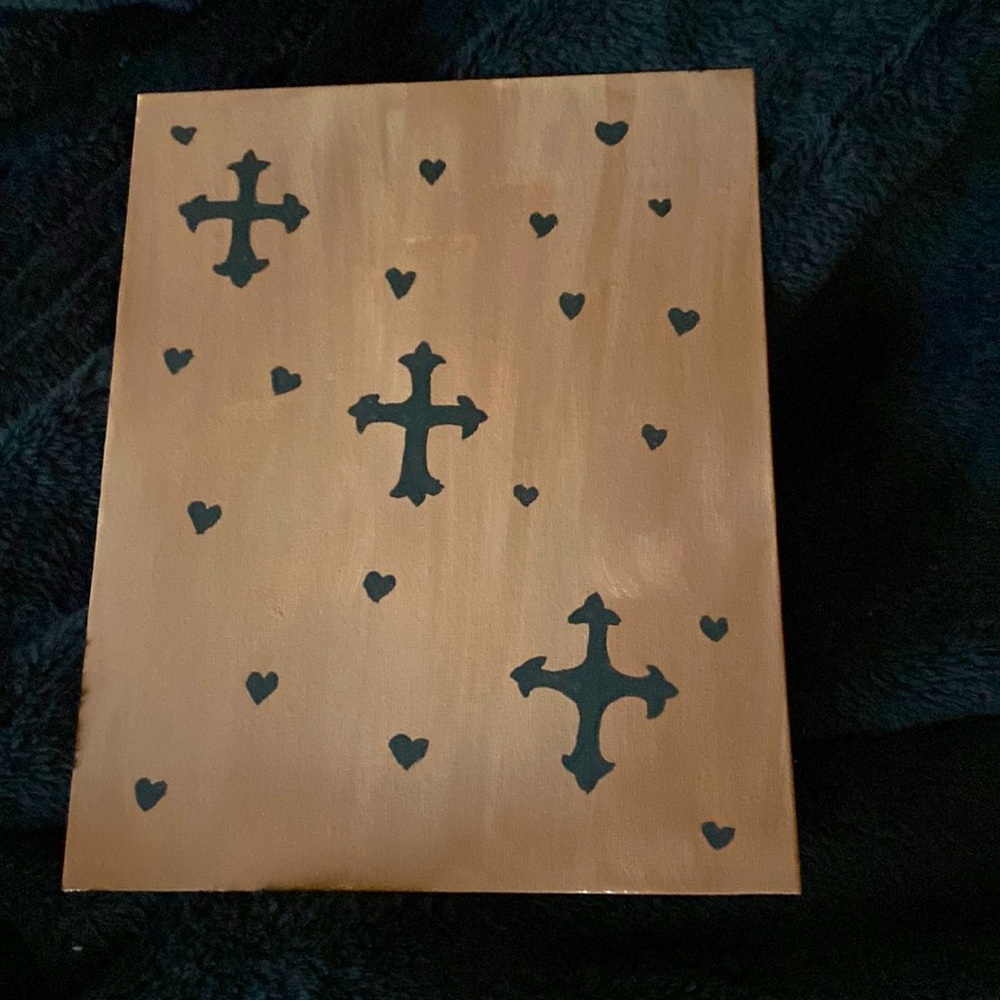 This is a canvas painting with crosses